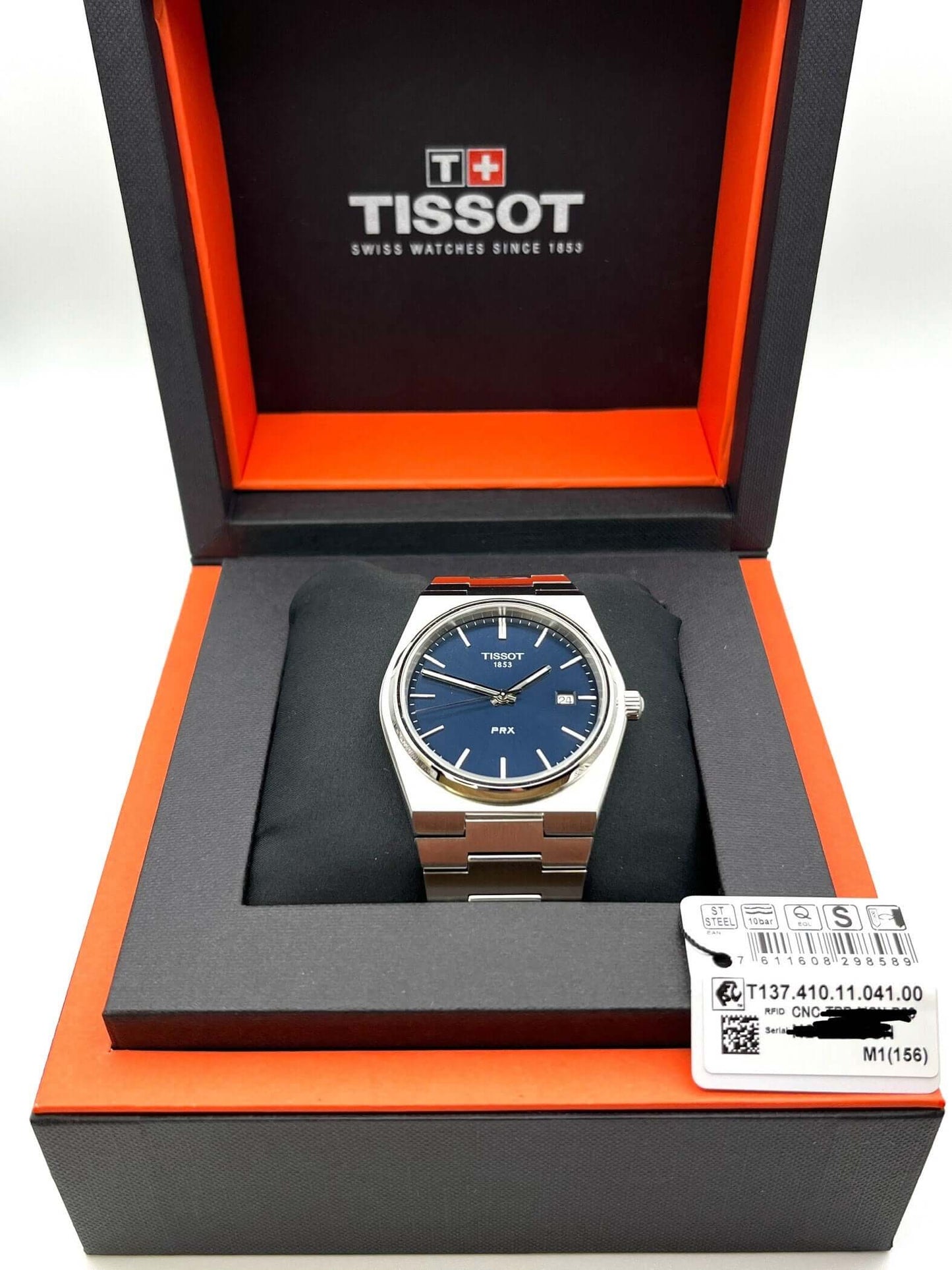 Tissot PRX Quartz T137.410.11.051.00 40mm stainless steel men’s watch with black dial, date display, sapphire crystal, and 100m water resistance
