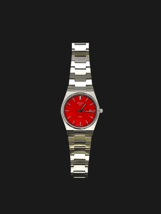 Tissot PRX Quartz T137.410.11.421.00 40mm stainless steel men’s watch with red dial, date display, sapphire crystal, and 100m water resistance
