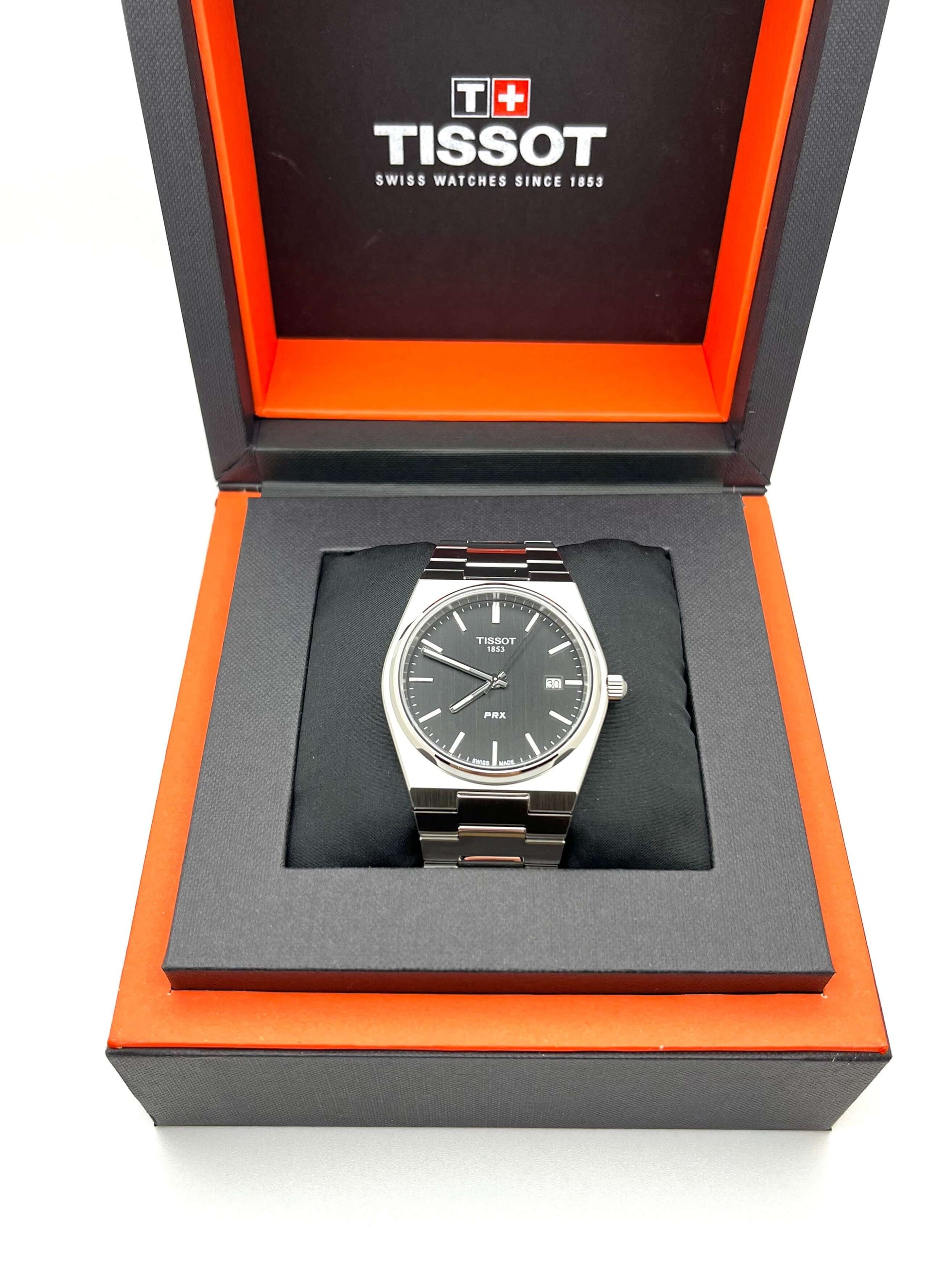 Tissot PRX Quartz T137.410.11.051.00 men’s 40mm stainless steel watch with black dial, date display, sapphire crystal, and 100m water resistance