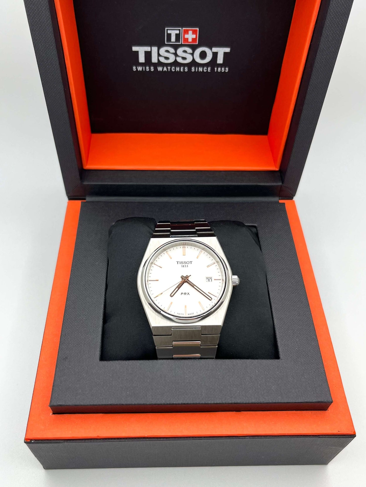 Tissot PRX Quartz T137.410.11.031.00 40mm stainless steel men’s watch with silver dial, date display, sapphire crystal, and 100m water resistance