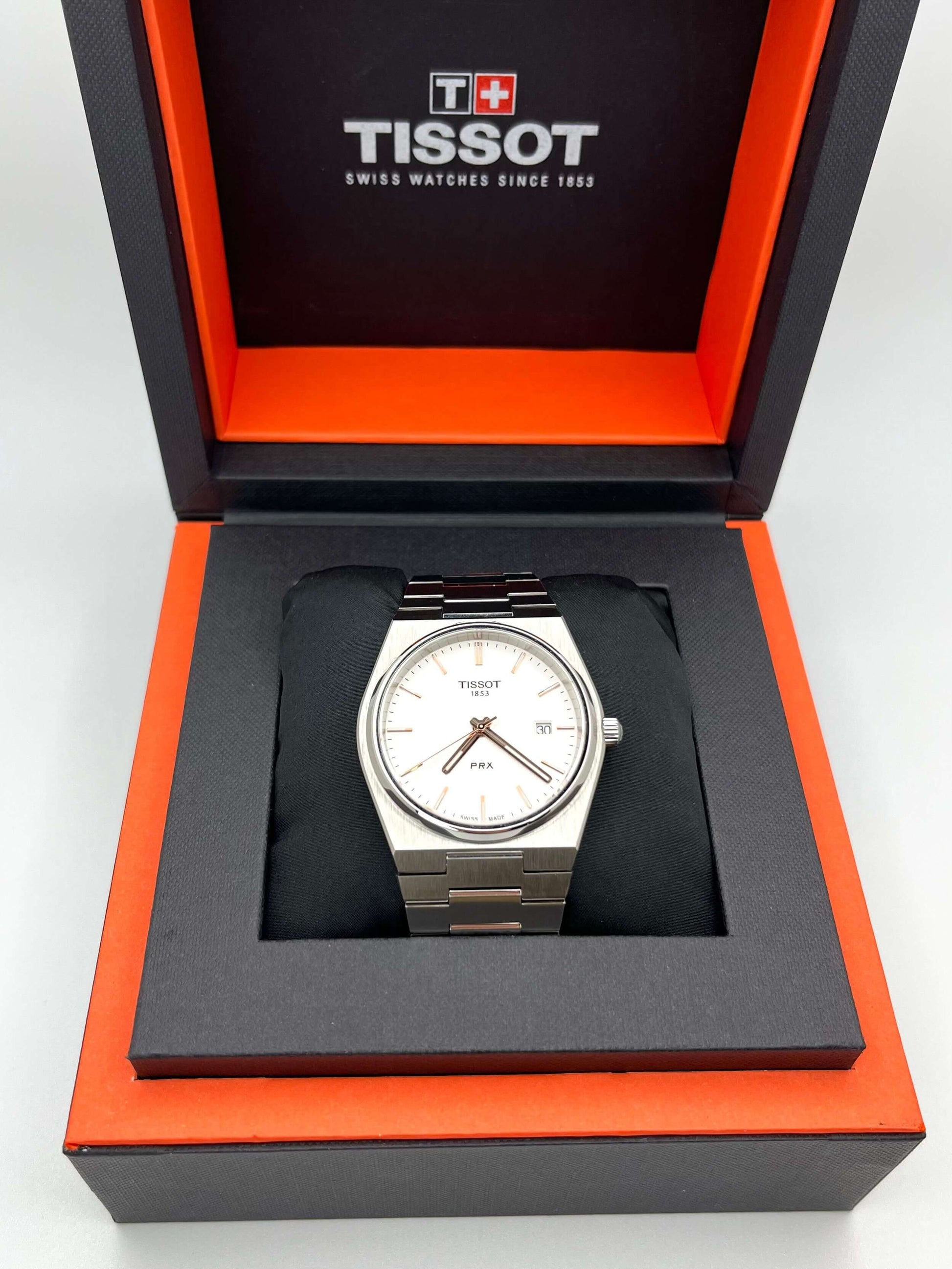 Tissot PRX Quartz T137.410.11.031.00 40mm stainless steel men’s watch with silver dial, date display, sapphire crystal, and 100m water resistance