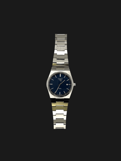 Tissot PRX Quartz T137.410.11.051.00 40mm stainless steel men’s watch with black dial, date display, sapphire crystal, and 100m water resistance