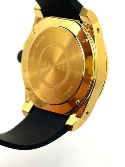 Gucci Dive YA136219 men’s 45mm gold PVD stainless steel watch with black rubber strap, ceramic bezel, black dial, sapphire crystal, Swiss quartz, 200m water resistant